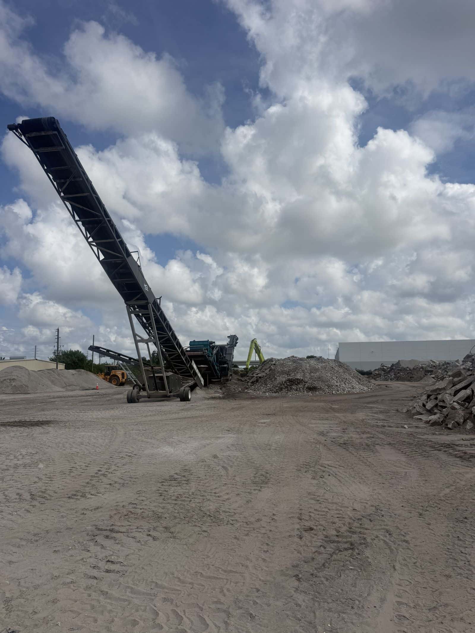 Screened clean fill dirt stockpiles at the ATLAS recycling yard in Clearwater, Florida